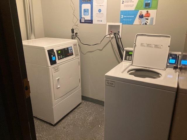 129 Elk Trl W Unit 329, Carol Stream, IL 60188 - community laundry room featuring separate washer and dryer