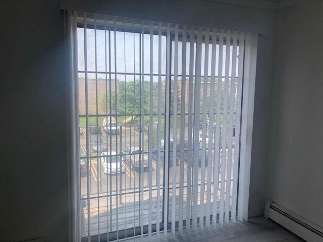 129 Elk Trl W Unit 329, Carol Stream, IL 60188 - detailed view of a baseboard heating unit and a gate