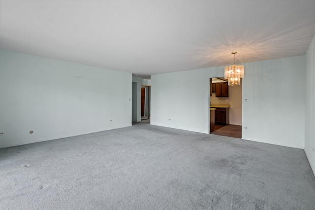 1717 W Crystal Ln Unit 310, Mount Prospect, IL 60056 - unfurnished living room with a chandelier and carpet