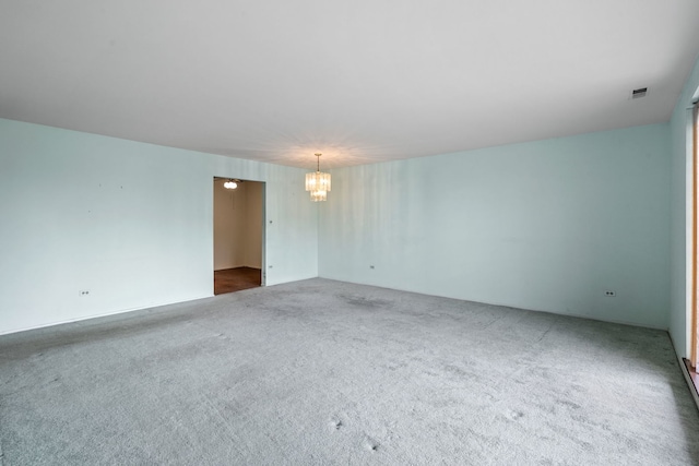 1717 W Crystal Ln Unit 310, Mount Prospect, IL 60056 - unfurnished room with a chandelier and dark colored carpet
