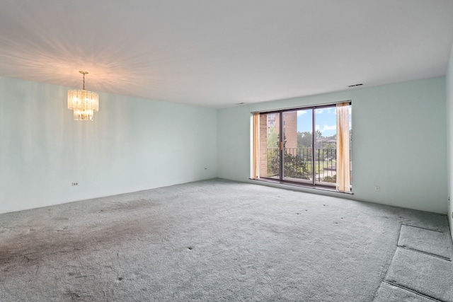 1717 W Crystal Ln Unit 310, Mount Prospect, IL 60056 - unfurnished room with a chandelier and carpet flooring