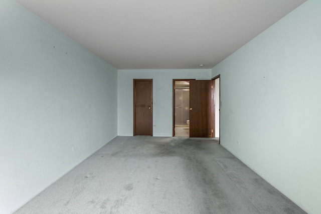 1717 W Crystal Ln Unit 310, Mount Prospect, IL 60056 - unfurnished bedroom with light carpet and connected bathroom