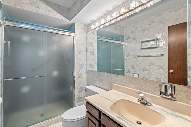 1717 W Crystal Ln Unit 310, Mount Prospect, IL 60056 - full bathroom featuring toilet, wallpapered walls, vanity, and a stall shower