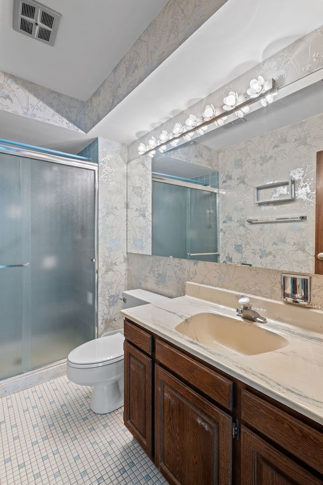 1717 W Crystal Ln Unit 310, Mount Prospect, IL 60056 - full bathroom featuring wallpapered walls, vanity, toilet, a stall shower, and tile patterned floors