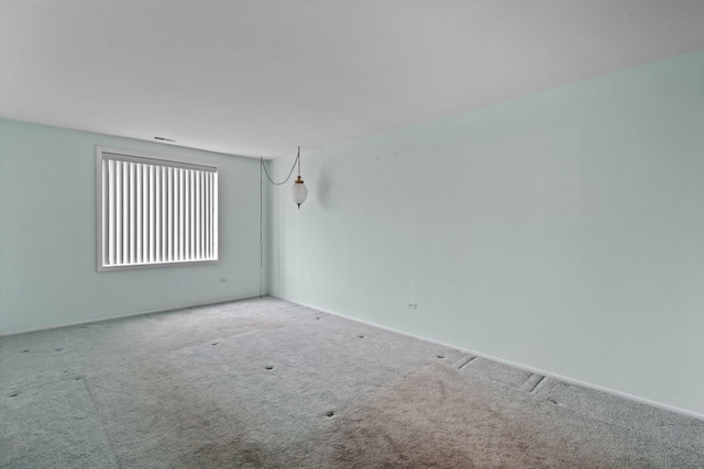 1717 W Crystal Ln Unit 310, Mount Prospect, IL 60056 - carpeted empty room featuring baseboards