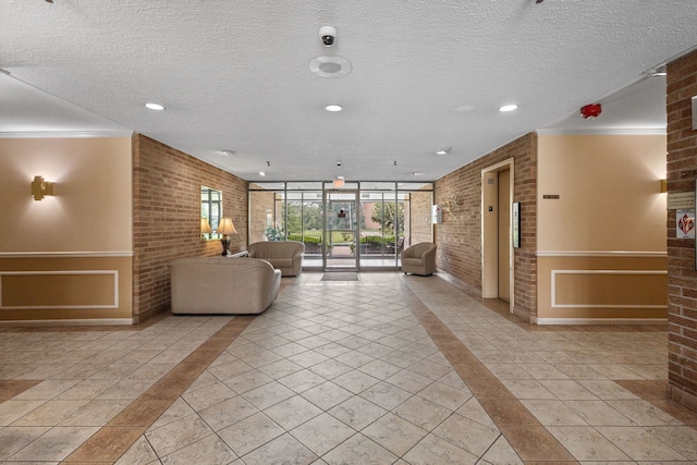 1717 W Crystal Ln Unit 310, Mount Prospect, IL 60056 - building lobby featuring brick wall, a textured ceiling, recessed lighting, a security system, and a wall of windows