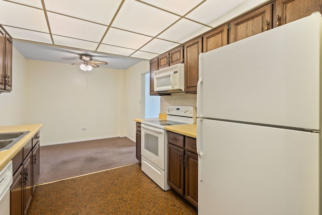1717 W Crystal Ln Unit 310, Mount Prospect, IL 60056 - kitchen featuring white appliances, a ceiling fan, light countertops, dark colored carpet, and a paneled ceiling