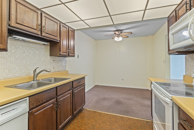 1717 W Crystal Ln Unit 310, Mount Prospect, IL 60056 - kitchen with white appliances, a sink, a ceiling fan, light countertops, and dark colored carpet