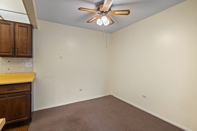 1717 W Crystal Ln Unit 310, Mount Prospect, IL 60056 - unfurnished dining area with ceiling fan, dark colored carpet, and baseboards