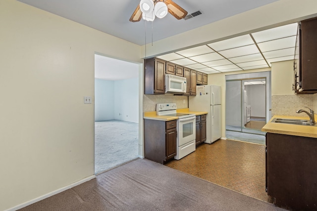 1717 W Crystal Ln Unit 310, Mount Prospect, IL 60056 - kitchen with white appliances, a sink, decorative backsplash, ceiling fan, and light countertops