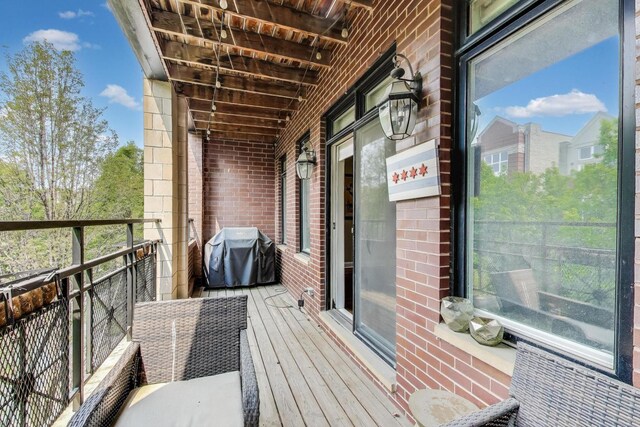 2120 W Rice St Unit 3, Chicago, IL 60622 - kitchen with stainless steel appliances, light wood-type flooring, dark brown cabinets, light stone countertops, and a sink