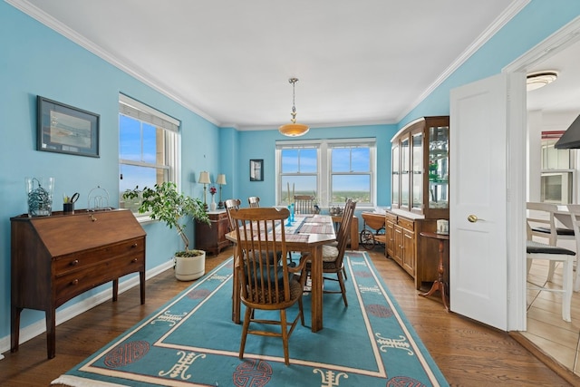 5555 N Sheridan Rd Unit 1906, Chicago, IL 60640 - dining room featuring crown molding, wood finished floors, and baseboards