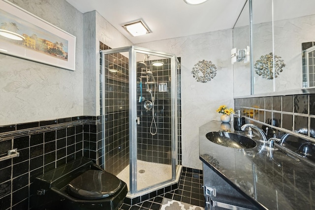 5555 N Sheridan Rd Unit 1906, Chicago, IL 60640 - bathroom with tile walls, a stall shower, vanity, toilet, and tile patterned flooring