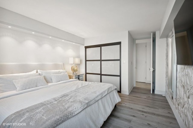 1440 N Lake Shore Dr Unit 34Ac, Chicago, IL 60610 - bedroom featuring light wood finished floors, baseboards, and recessed lighting