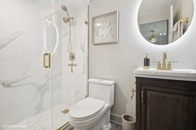 1440 N Lake Shore Dr Unit 34Ac, Chicago, IL 60610 - bathroom featuring a marble finish shower, vanity, toilet, and baseboards