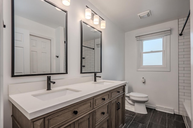 1110 71st St, Darien, IL 60561 - bathroom featuring double vanity, a shower, toilet, and baseboards