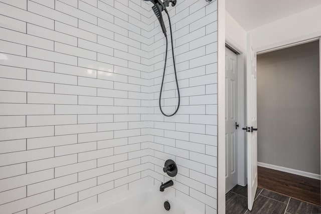 1110 71st St, Darien, IL 60561 - full bath featuring  shower combination, baseboards, and wood finished floors