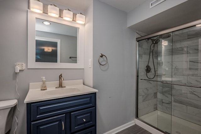 1110 71st St, Darien, IL 60561 - full bathroom featuring toilet, vanity, a shower stall, and baseboards