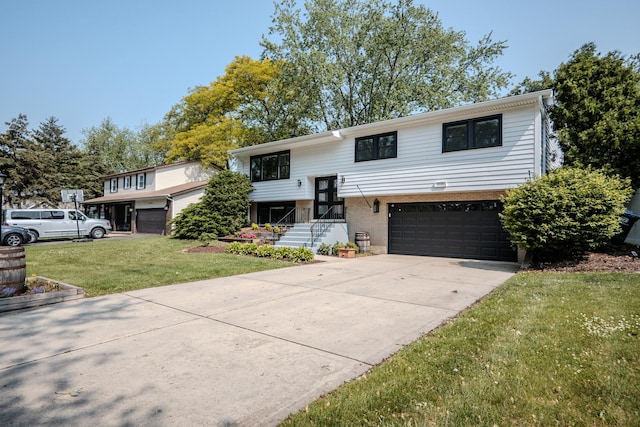 1110 71st St, Darien, IL 60561 - split foyer home featuring a garage, concrete driveway, a front lawn, and brick siding
