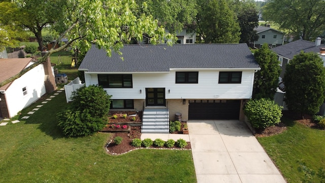 1110 71st St, Darien, IL 60561 - raised ranch with a front yard, driveway, a garage, french doors, and a shingled roof