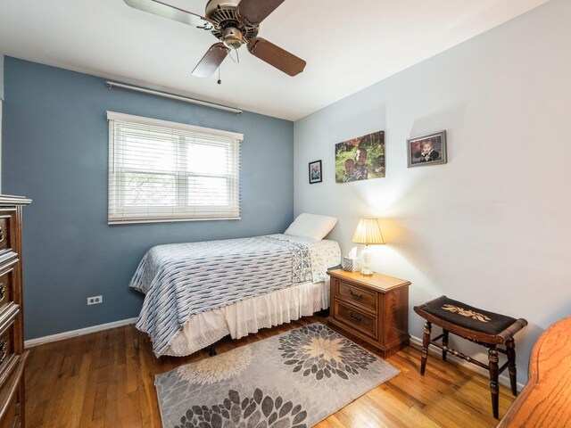 521 Harvard Ln, Hoffman Estates, IL 60169 - bedroom with wood finished floors, baseboards, and ceiling fan