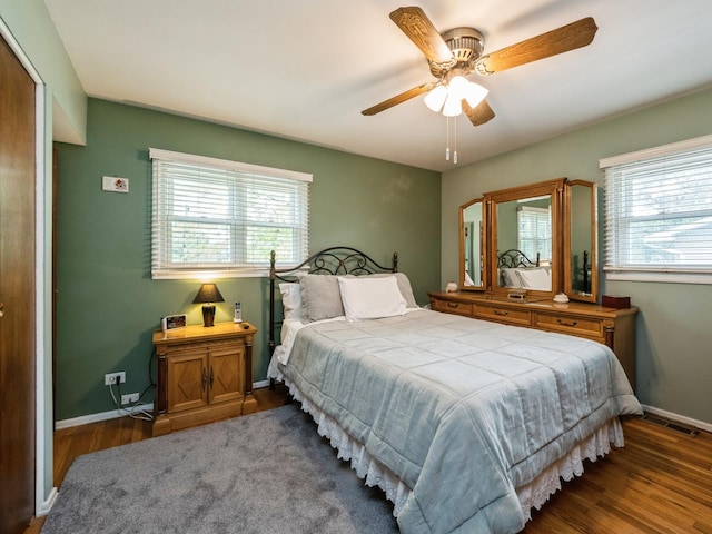 521 Harvard Ln, Hoffman Estates, IL 60169 - bedroom with multiple windows, wood finished floors, baseboards, and ceiling fan