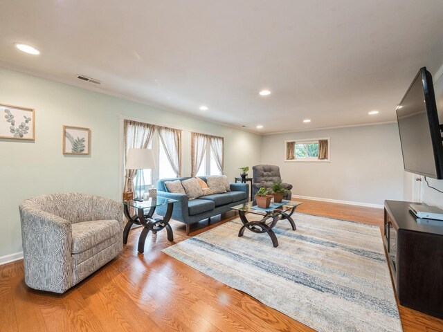 521 Harvard Ln, Hoffman Estates, IL 60169 - living area featuring light wood-style floors, baseboards, recessed lighting, and ornamental molding