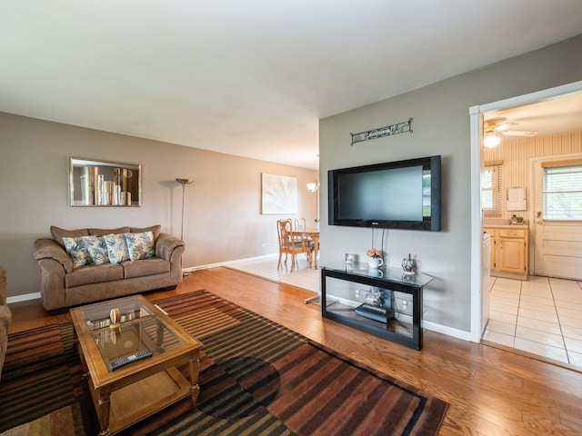 521 Harvard Ln, Hoffman Estates, IL 60169 - living room with baseboards, light wood finished floors, and ceiling fan