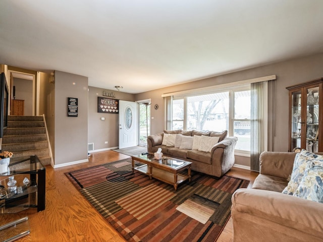 521 Harvard Ln, Hoffman Estates, IL 60169 - living room featuring baseboards, wood finished floors, and stairway