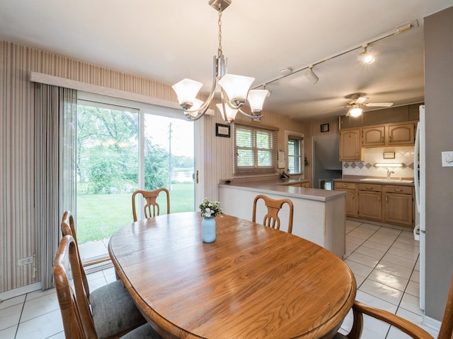 521 Harvard Ln, Hoffman Estates, IL 60169 - dining space featuring track lighting, light tile patterned floors, ceiling fan, a chandelier, and wallpapered walls