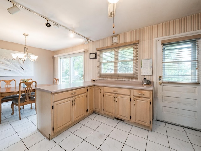 521 Harvard Ln, Hoffman Estates, IL 60169 - kitchen with a chandelier, rail lighting, light countertops, pendant lighting, and light brown cabinets