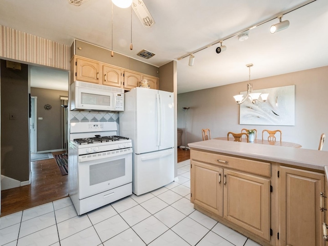 521 Harvard Ln, Hoffman Estates, IL 60169 - kitchen featuring white appliances, light brown cabinetry, track lighting, and a chandelier