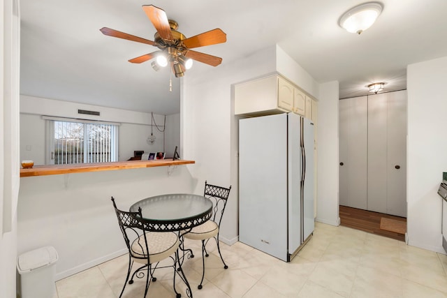 1615 E Central Rd Unit 410B, Arlington Heights, IL 60005 - kitchen featuring freestanding refrigerator, ceiling fan, and baseboards