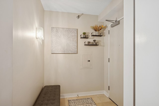 512 N Mcclurg Ct Unit 1009, Chicago, IL 60611 - laundry area featuring electric panel, light tile patterned floors, and baseboards