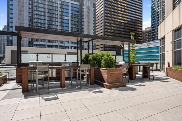 512 N Mcclurg Ct Unit 1009, Chicago, IL 60611 - view of patio / terrace with a view of city and outdoor dining area