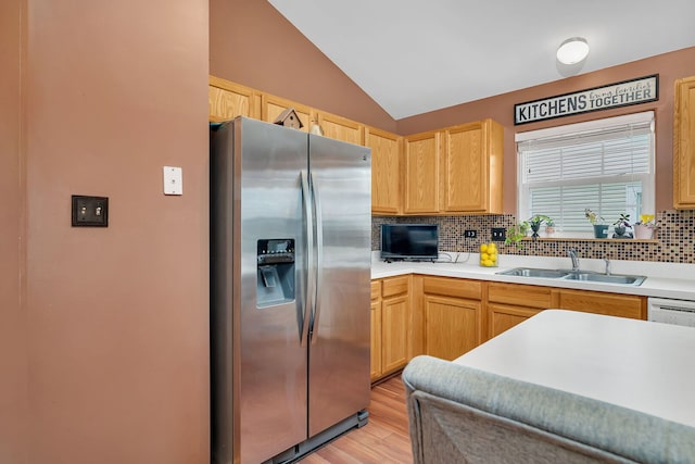 117 Andrew Taras Ct Unit B1, Joliet, IL 60435 - kitchen featuring stainless steel fridge with ice dispenser, a sink, tasteful backsplash, light wood-style flooring, and vaulted ceiling