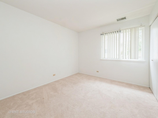 127 Wolcott Ct Unit 2, Schaumburg, IL 60193 - empty room with carpet flooring and baseboards
