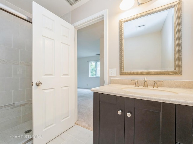127 Wolcott Ct Unit 2, Schaumburg, IL 60193 - full bath with vanity, a tile shower, and tile patterned flooring