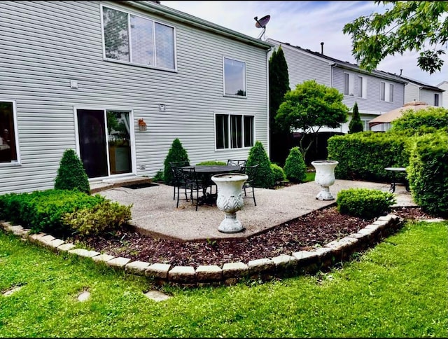 34165 N Goldenrod Rd, Round Lake, IL 60073 - back of house featuring a patio and a lawn