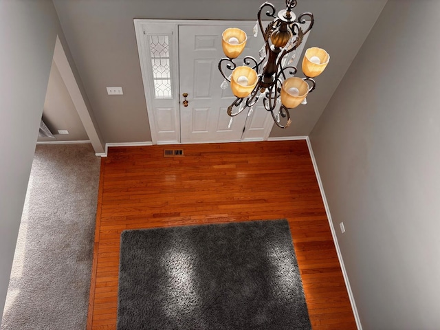 34165 N Goldenrod Rd, Round Lake, IL 60073 - entrance foyer with a chandelier, baseboards, and wood finished floors