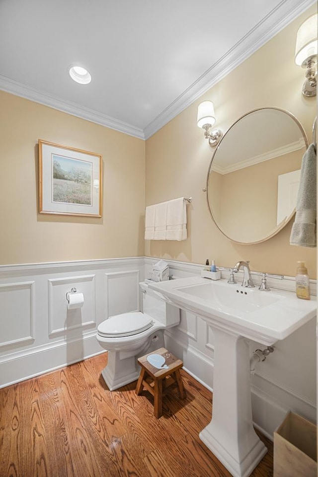 201 Reber St Unit 6, Wheaton, IL 60187 - bathroom featuring ornamental molding, wood finished floors, wainscoting, and a decorative wall