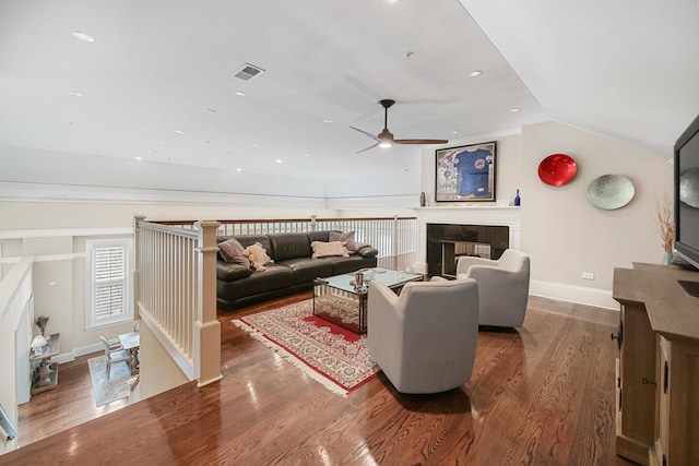 201 Reber St Unit 6, Wheaton, IL 60187 - living area featuring ceiling fan, wood finished floors, vaulted ceiling, a tiled fireplace, and recessed lighting