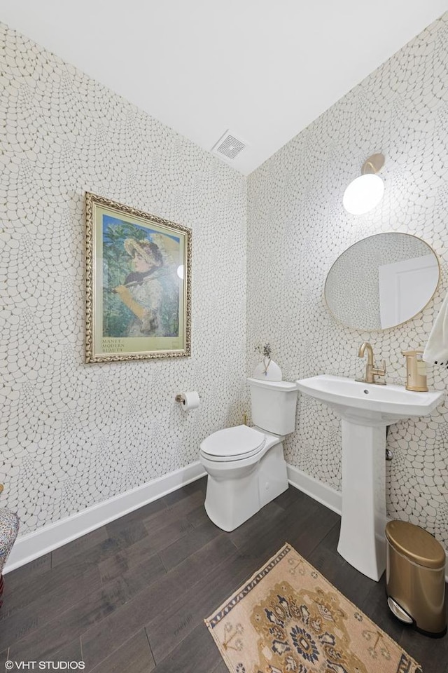 50 W Kennedy Ln Unit 102, Hinsdale, IL 60521 - half bath with wood finished floors, toilet, and baseboards
