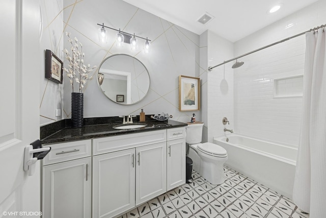 50 W Kennedy Ln Unit 102, Hinsdale, IL 60521 - full bath with vanity, toilet, shower / tub combo, and tile walls