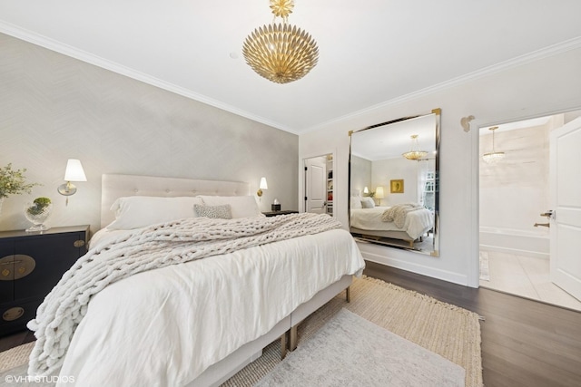 50 W Kennedy Ln Unit 102, Hinsdale, IL 60521 - bedroom featuring wood finished floors, ornamental molding, baseboards, a chandelier, and a spacious closet
