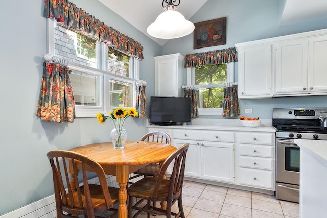 674 Foxdale Ave, Winnetka, IL 60093 - dining space with vaulted ceiling and light tile patterned flooring