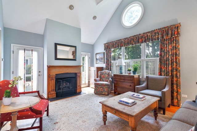 674 Foxdale Ave, Winnetka, IL 60093 - living area with high vaulted ceiling, plenty of natural light, and a fireplace with raised hearth