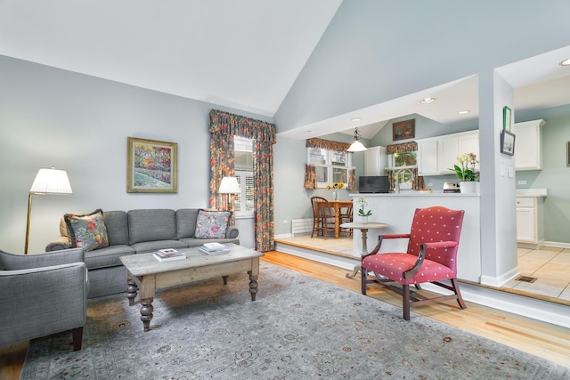 674 Foxdale Ave, Winnetka, IL 60093 - living area with light wood finished floors, recessed lighting, and high vaulted ceiling
