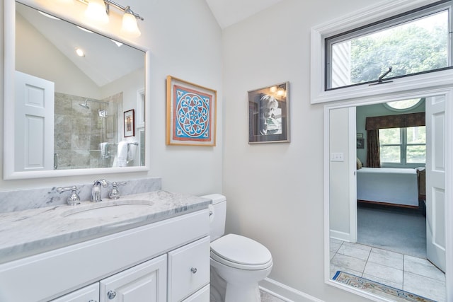 674 Foxdale Ave, Winnetka, IL 60093 - full bathroom featuring vaulted ceiling, a tile shower, vanity, ensuite bath, and tile patterned flooring