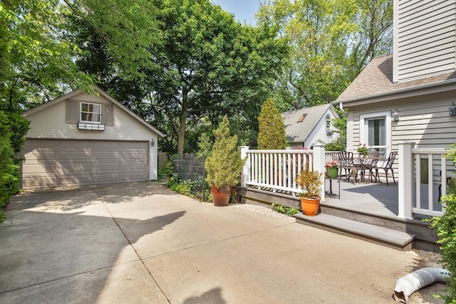 674 Foxdale Ave, Winnetka, IL 60093 - view of patio with a detached garage and an outbuilding